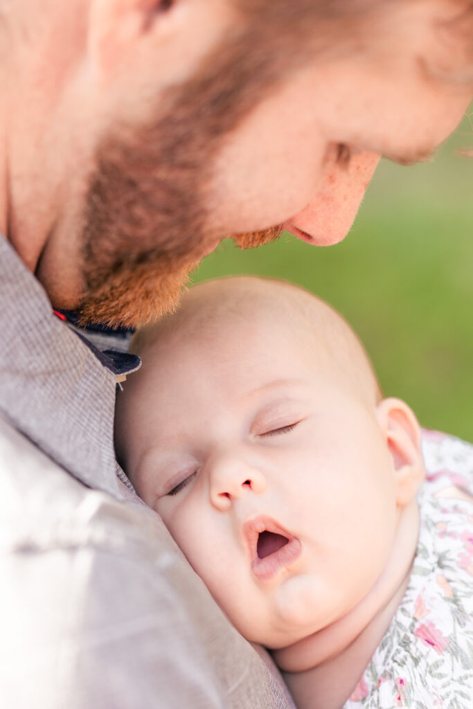 sweet baby sleeping in arms